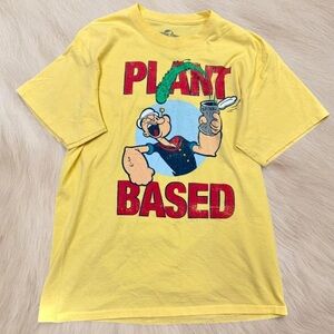 Universal Yellow 'Plant Based' Graphic Tee with Red Lettering